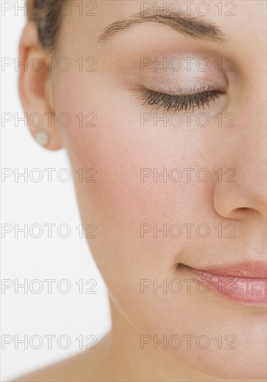 Close up of woman with eyes closed.