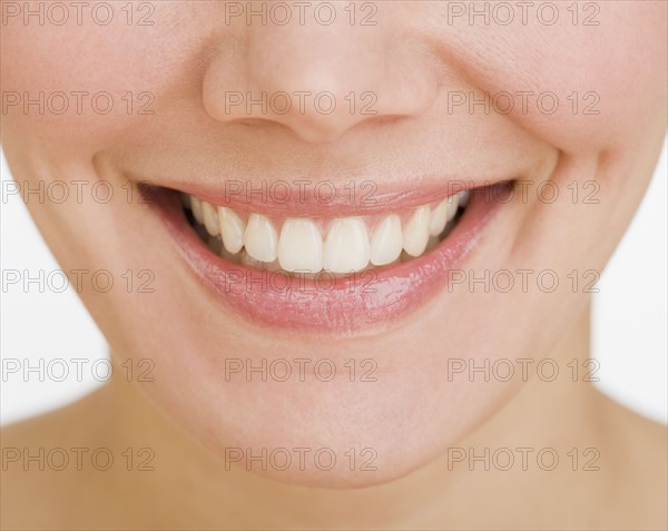 Close up of woman smiling.