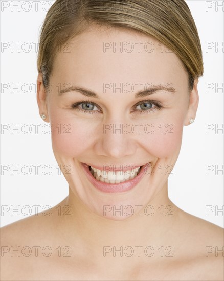 Close up of woman smiling.