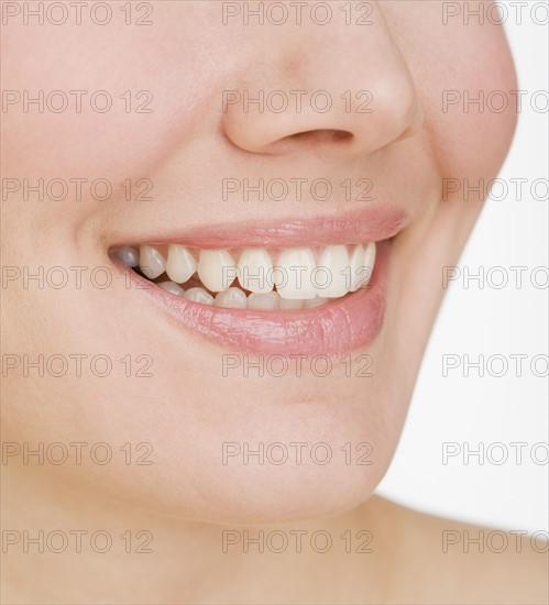 Close up of woman smiling.