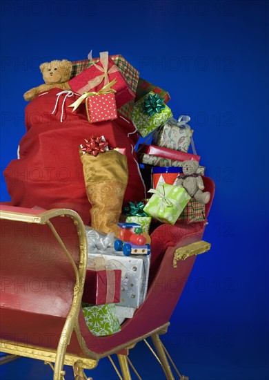 Sleigh with bag of Christmas toys.