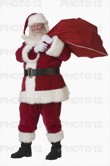 Santa Claus holding bag of toys.