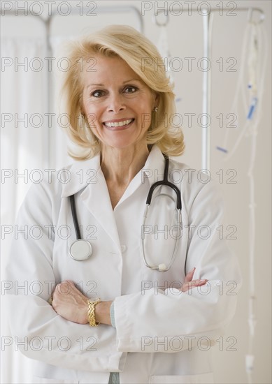 Female doctor with arms crossed.