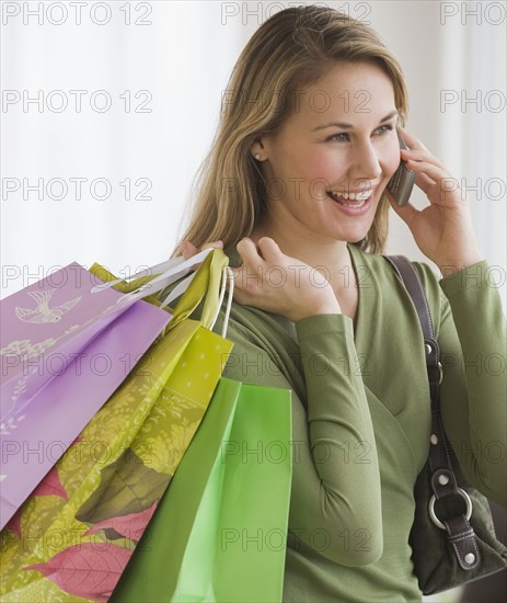 Woman carrying shopping bags.