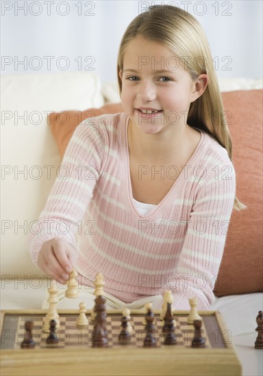 Girl playing chess.