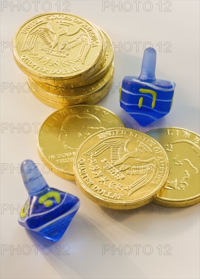 Close up of Chanukah coins and dreidels.