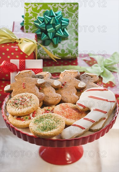 Christmas cookies in front of gifts.