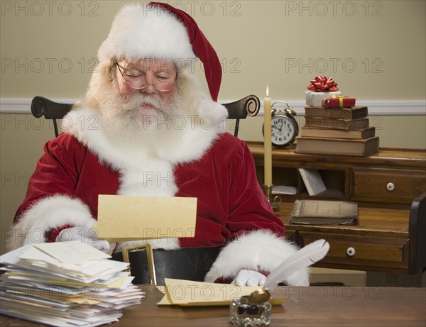 Santa Claus reading mail.