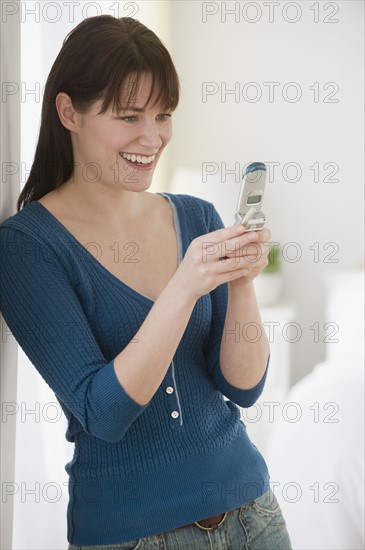 Woman looking at cell phone.