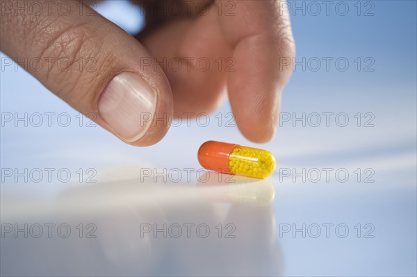 Man reaching for medication.