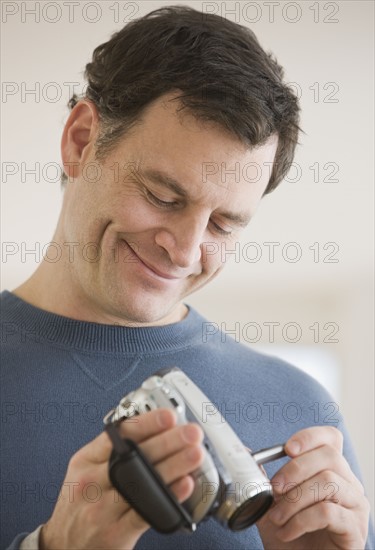 Man looking at video camera.