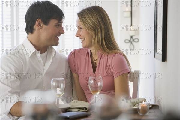 Couple smiling at each other.