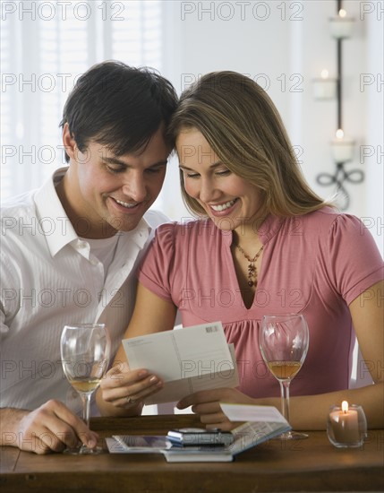 Couple reading mail.