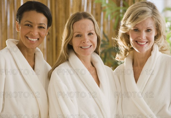 Multi-ethnic woman wearing bathrobes.