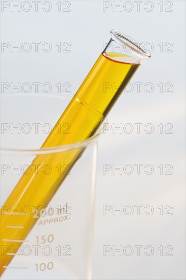 Vial of liquid in beaker.