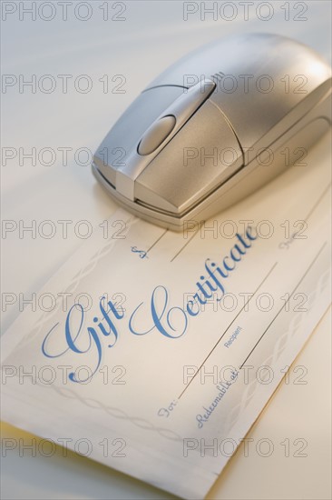 Computer mouse on gift certificate.