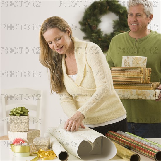 Woman wrapping gifts.