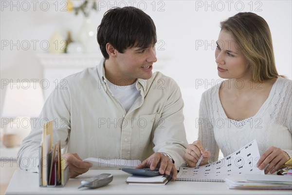 Couple paying bills.