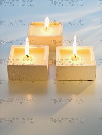 Close up of lit candles.