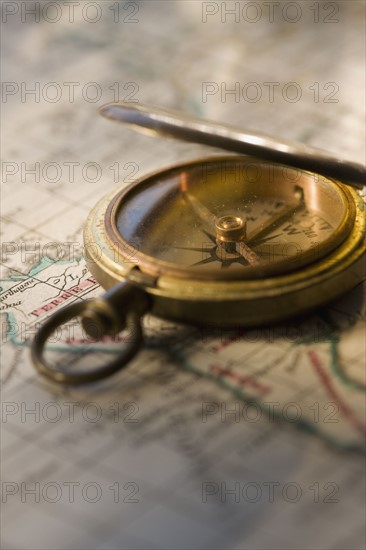 Compass on antique map.