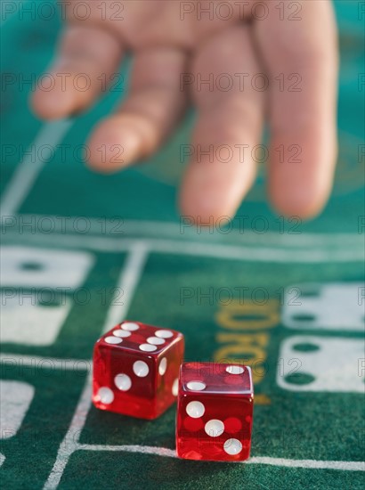 Close up of man throwing dice.