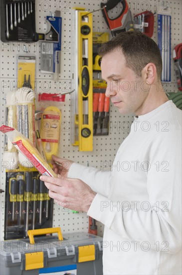 Man shopping at hardware store.