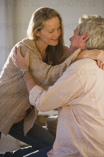 Couple smiling at each other.