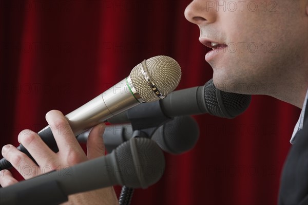 Man speaking into microphone.