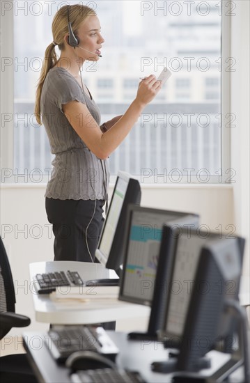 Businesswoman wearing headset.