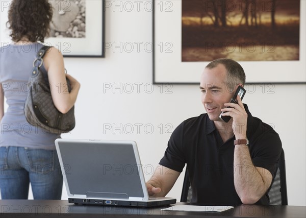 Businessman talking on cell phone.