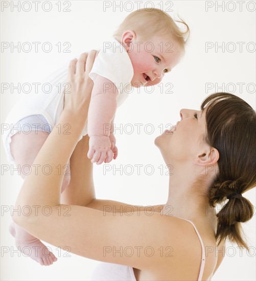 Mother smiling at baby. Date : 2008