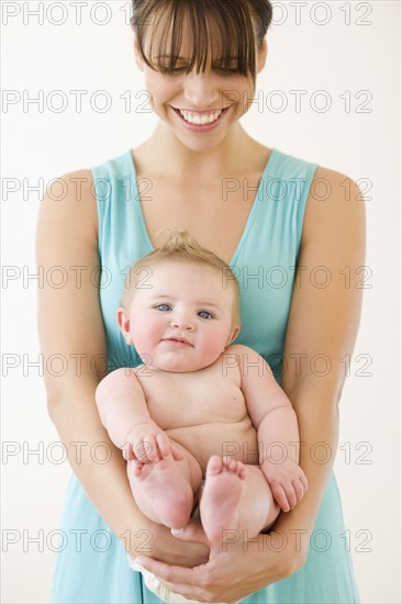 Mother holding baby. Date : 2008