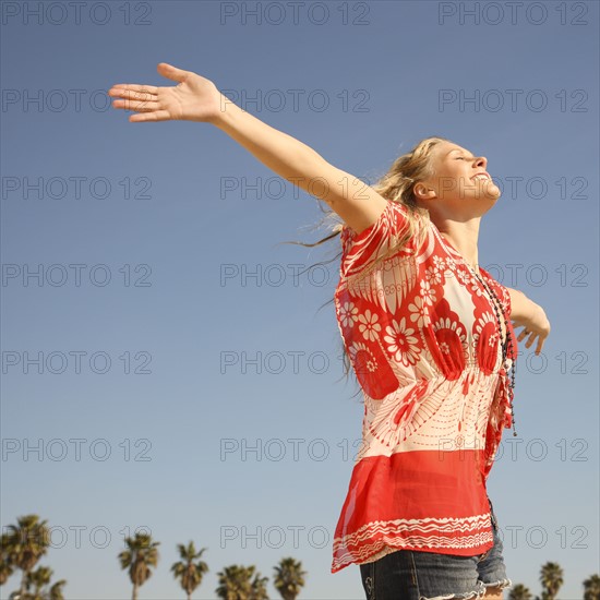 Woman with arms outstretched. Date : 2008