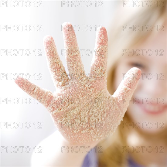 Girl with sand on hand. Date : 2008