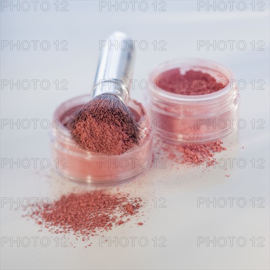 Close up of mineral cosmetics and brush.