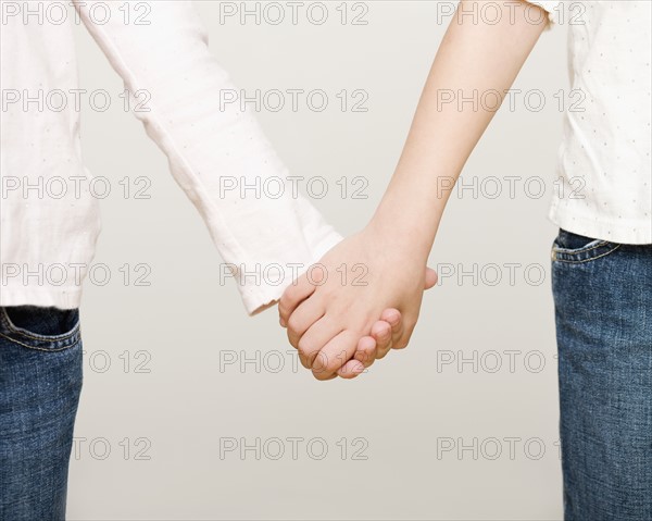 Two girls holding hands. Date : 2008