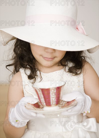 Hispanic girl dressed up at tea party. Date : 2008