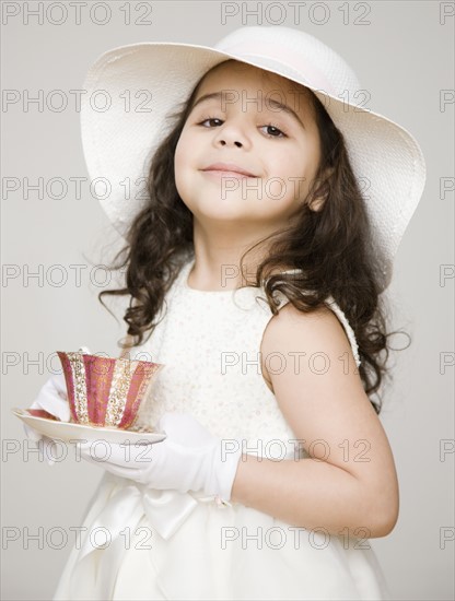 Hispanic girl dressed up at tea party. Date : 2008