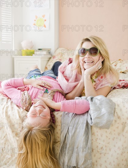 Mother and daughter playing dress up. Date : 2008