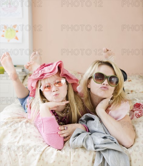 Mother and daughter playing dress up. Date : 2008