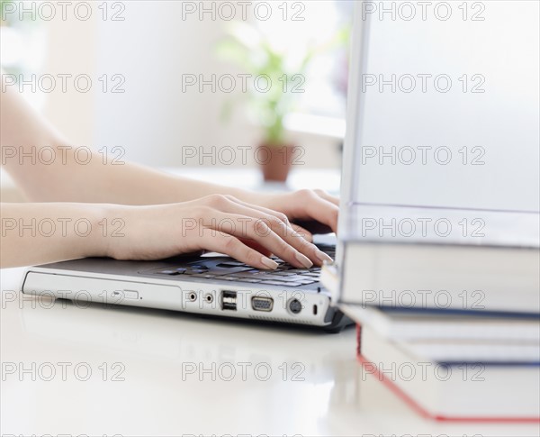Woman typing on laptop. Date : 2008