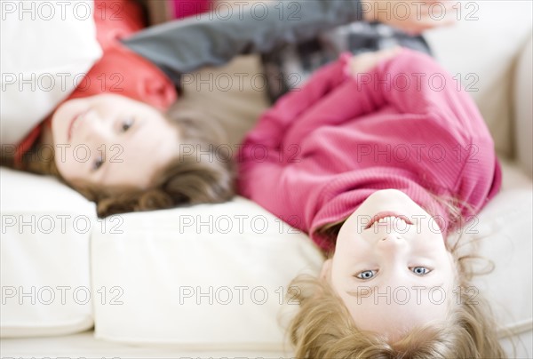 Sisters laying on sofa. Date : 2008