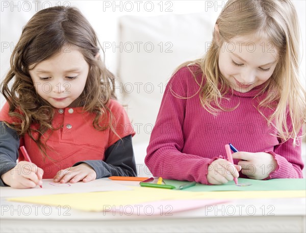 Close up of sisters coloring. Date : 2008