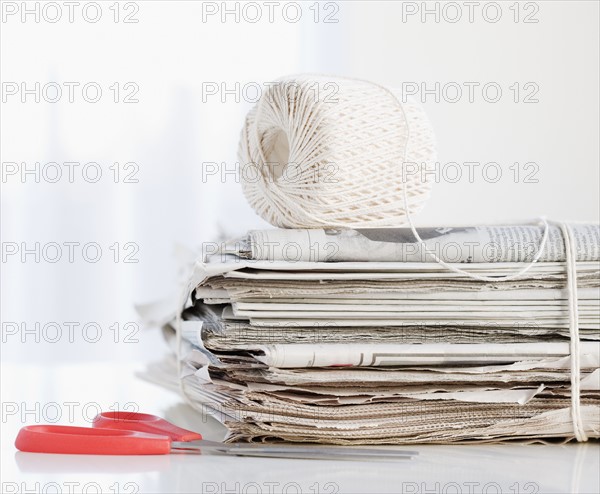 String and scissors with newspaper bundle. Date : 2008