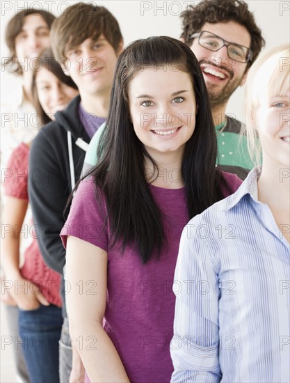 Group of friends standing in row. Date : 2008