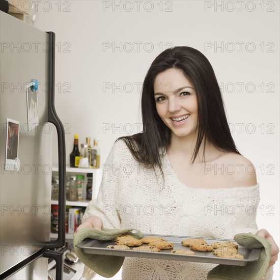 Woman holding tray of cookies. Date : 2008