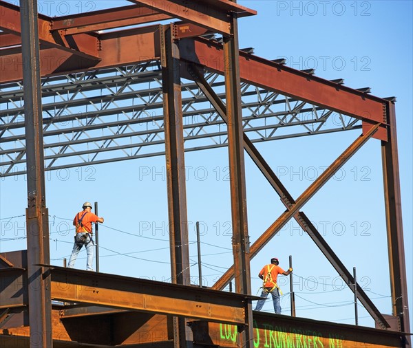 Construction workers walking on steel girders, New York City, New York, United States. Date : 2008