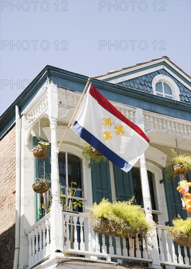 Low angle view of flag on balcony, French Quarter, New Orleans, Louisiana, United States. Date : 2008