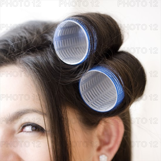Close up of curlers in woman’s hair. Date : 2008