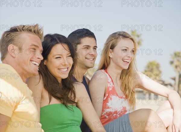 Two couple sitting on beach. Date : 2008